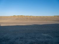 an empty airport runway and road with a message on it in english, saying goodbye