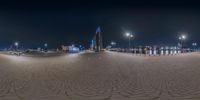 a photo taken from the fish eye lens of a circular view of a city skyline at night