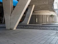 a parking garage with concrete pillars and columns that have been carved into the side of the building