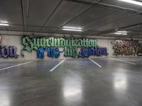 a parking garage with graffiti on the wall and two skateboards leaning up against each other