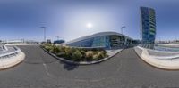 three panorama images of an airport with a large building in the background, taken in a fisheye lens