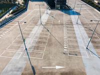 a parking lot with many cars on top of it and an arrow pointing up at it