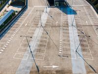 a parking lot with many cars on top of it and an arrow pointing up at it