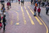people walking on the street near some stores and buildings with signs that read'people can walk through '