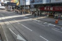 this is an image of people walking down the street from the tram track in china
