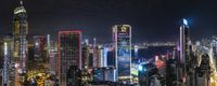 a view of a city in china at night from a height of the empire, victoria centre, with a sea and the huang