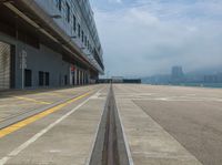 the yellow lines are indicating that a plane is parked on the tarmac near the loading docks