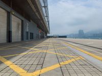 the yellow lines are indicating that a plane is parked on the tarmac near the loading docks