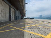 the yellow lines are indicating that a plane is parked on the tarmac near the loading docks