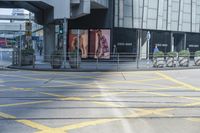 yellow lines painted on the street of a city street with people walking around and parked motorcycles next to them