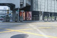 yellow lines painted on the street of a city street with people walking around and parked motorcycles next to them