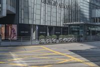 yellow lines painted on the street of a city street with people walking around and parked motorcycles next to them