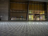 an empty floor is shown inside a building that is on one side of a sidewalk