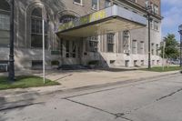 this building has a sign that reads the hotel on it's corner of the street