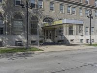 this building has a sign that reads the hotel on it's corner of the street