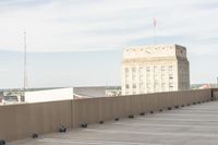 there is a large building that sits behind the building in this photo and looks out