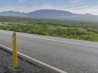 Iceland Landscape: Road, Mountain, and Clouds