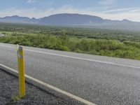 Iceland Landscape: Road, Mountain, and Clouds