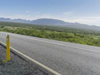 Iceland Landscape: Road, Mountain, and Clouds