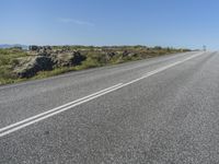 a car that is sitting on the side of the road while waiting for a turn