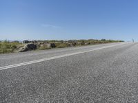 a car that is sitting on the side of the road while waiting for a turn