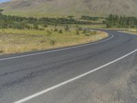 the road has white paint on it to mark its shape and length on a side