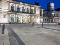 an illuminated city square is pictured in this picture of a very nice night time picture