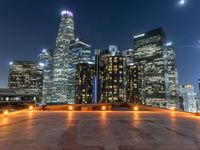 the city skylines are illuminated at night in this time lapshoton photograph taken