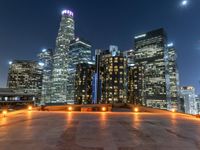 the city skylines are illuminated at night in this time lapshoton photograph taken