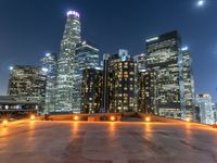 the city skylines are illuminated at night in this time lapshoton photograph taken