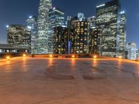 the city skylines are illuminated at night in this time lapshoton photograph taken