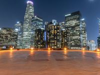 the city skylines are illuminated at night in this time lapshoton photograph taken