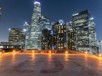 the city skylines are illuminated at night in this time lapshoton photograph taken