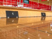 this is the gym floor for people to play basketball and basketball, the size of an indoor court