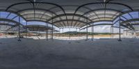 the inside of a building under construction with a big ceiling and many columns inside of the structure