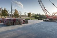 several pallets of lumber stacked on a truck bed with the sun shining through them