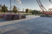 several pallets of lumber stacked on a truck bed with the sun shining through them