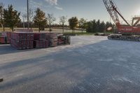 several pallets of lumber stacked on a truck bed with the sun shining through them