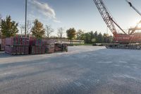 several pallets of lumber stacked on a truck bed with the sun shining through them