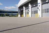 an asphalt lot with a parking area in front of it, showing various types of parking areas