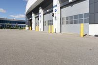 an asphalt lot with a parking area in front of it, showing various types of parking areas