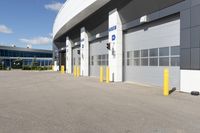 an asphalt lot with a parking area in front of it, showing various types of parking areas