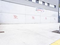 a fire hydrant sitting next to a building with signs on it of construction done