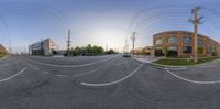 this is an image of a 360 - view street corner in an industrial area with buildings and wires