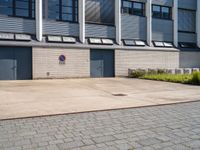 the door is open to let you into the building from the street behind it, but no parking