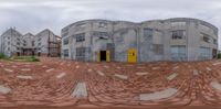 a very big building with some nice bricks and a yellow door on the front side