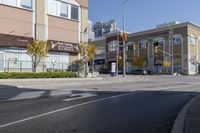 an intersection with street lights, stop lights and pedestrians at the corner of the intersection