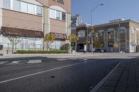 an intersection with street lights, stop lights and pedestrians at the corner of the intersection