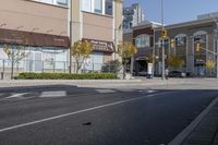 an intersection with street lights, stop lights and pedestrians at the corner of the intersection