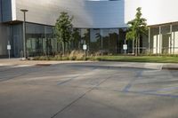 two fire hydrant on parking space in front of large building at dusk time, with open window